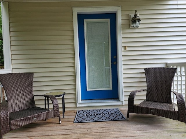 doorway to property featuring a wooden deck