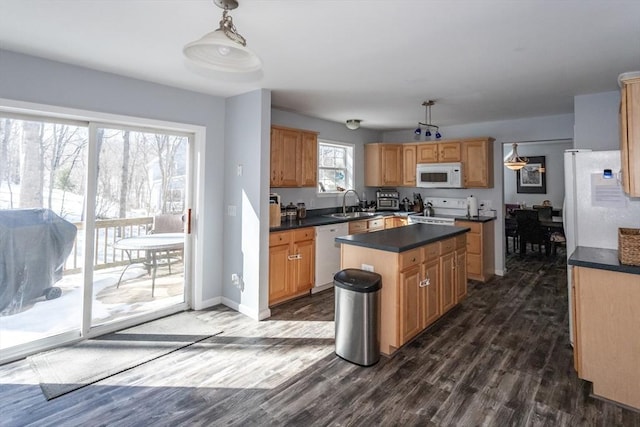 kitchen featuring white appliances, baseboards, a kitchen island, dark wood-type flooring, and dark countertops