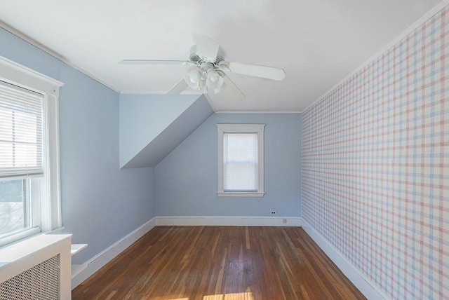 bonus room with wallpapered walls, baseboards, radiator heating unit, wood finished floors, and vaulted ceiling