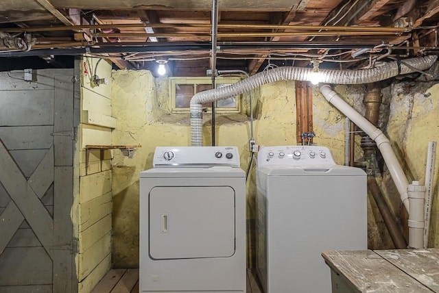 clothes washing area with laundry area and separate washer and dryer