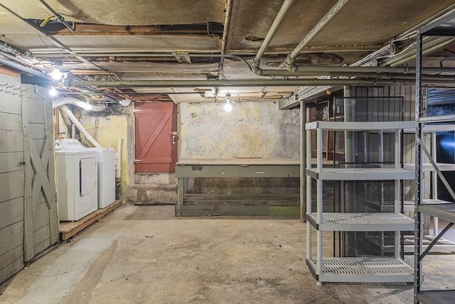 unfinished basement with washer and clothes dryer