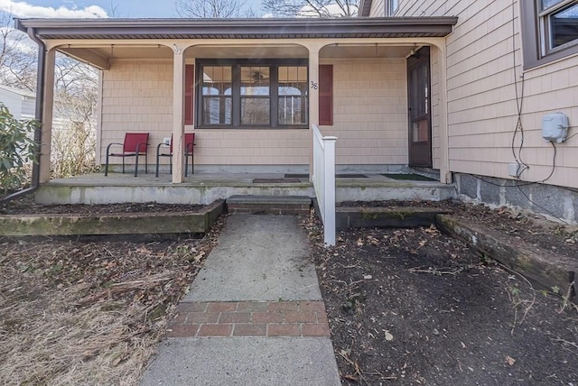 entrance to property featuring covered porch