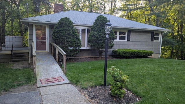 17 Laurel Dr, Millbury, MA 01527 - ranch-style house with a chimney, a front lawn, a shingled roof, and a deck