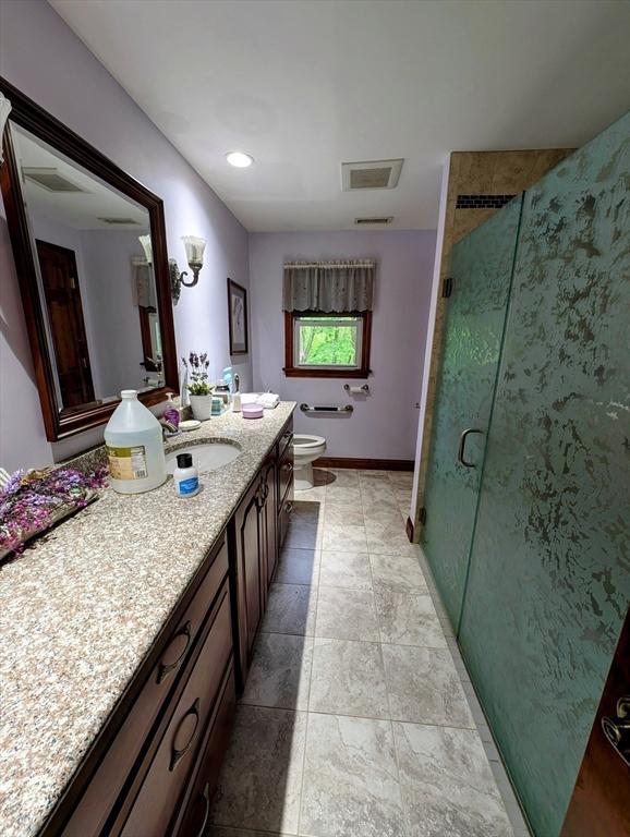 17 Laurel Dr, Millbury, MA 01527 - bathroom featuring vanity, a shower stall, and toilet