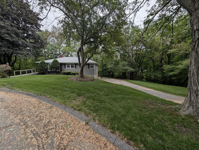 17 Laurel Dr, Millbury, MA 01527 - ranch-style house featuring a front lawn, driveway, and a chimney