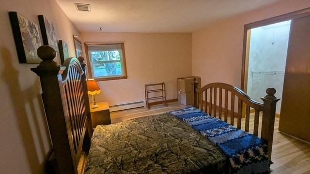 17 Laurel Dr, Millbury, MA 01527 - bedroom featuring wood finished floors and a baseboard radiator
