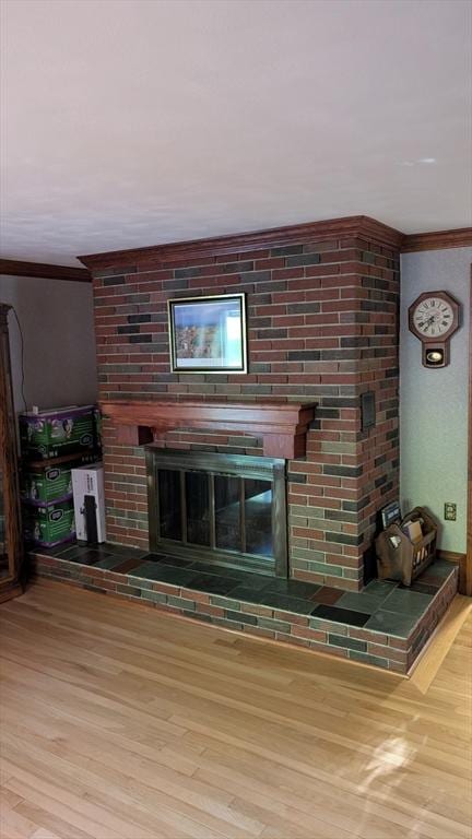 17 Laurel Dr, Millbury, MA 01527 - detailed view of a fireplace, ornamental molding, and wood finished floors