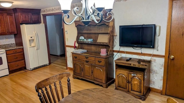 17 Laurel Dr, Millbury, MA 01527 - kitchen with white appliances, light wood-style flooring, a chandelier, and baseboards