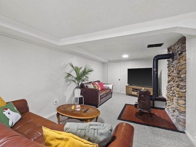 14 Riverside Dr, North Reading, MA 01864 - carpeted living area featuring baseboards and a wood stove