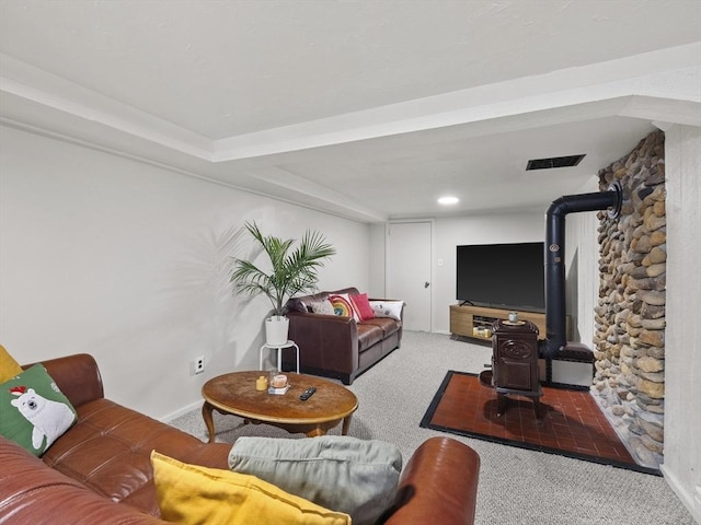 14 Riverside Dr, North Reading, MA 01864 - carpeted living room featuring baseboards and a wood stove