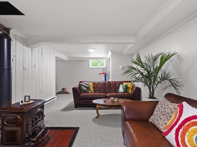 14 Riverside Dr, North Reading, MA 01864 - living room featuring a wood stove, carpet, a baseboard radiator, and wood walls