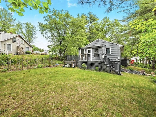 14 Riverside Dr, North Reading, MA 01864 - view of green lawn with a wooden deck and stairs