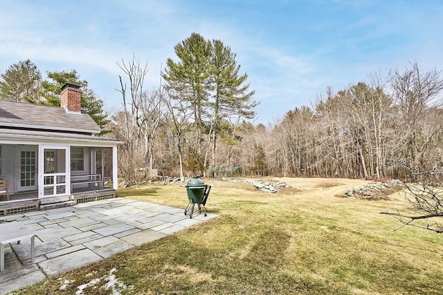 view of yard with a patio and a sunroom