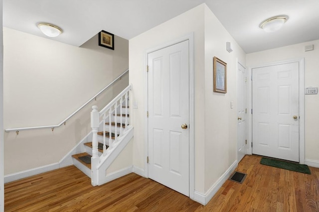 2826 Washington St, Boston, MA 02119 - stairs with wood finished floors and baseboards