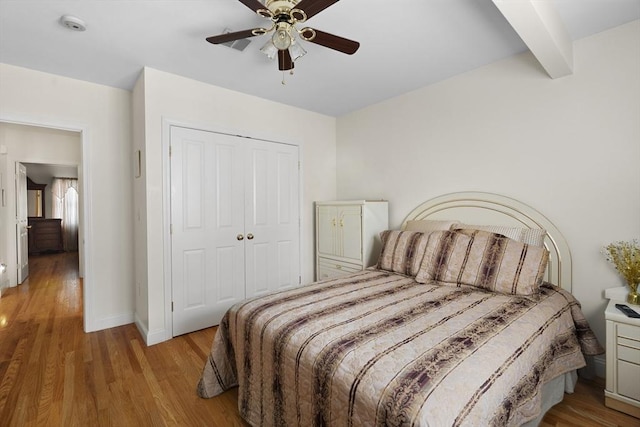 2826 Washington St, Boston, MA 02119 - bedroom featuring a closet, wood finished floors, baseboards, ceiling fan, and beam ceiling