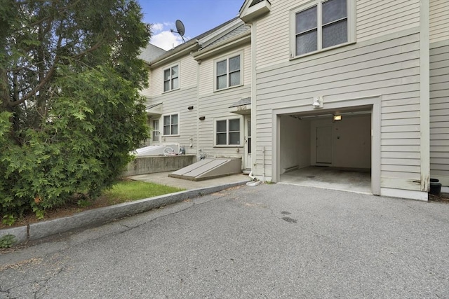 2826 Washington St, Boston, MA 02119 - rear view of house featuring driveway and an attached garage