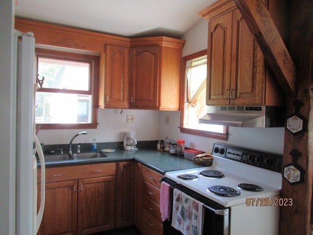 kitchen featuring white electric range oven and sink