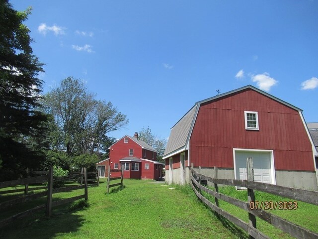 view of outdoor structure featuring a lawn