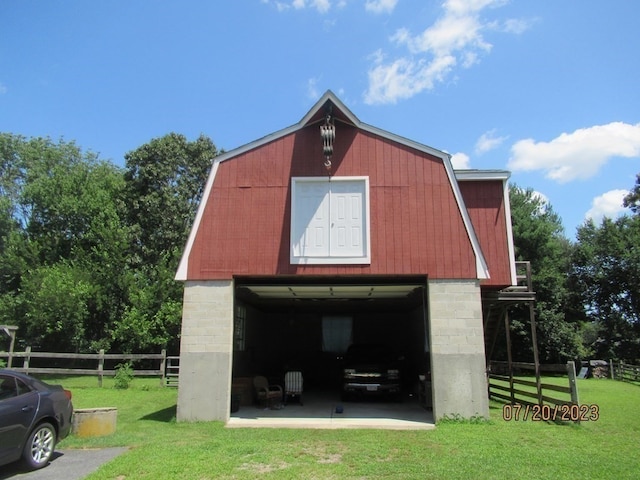 view of outbuilding featuring a yard and a garage