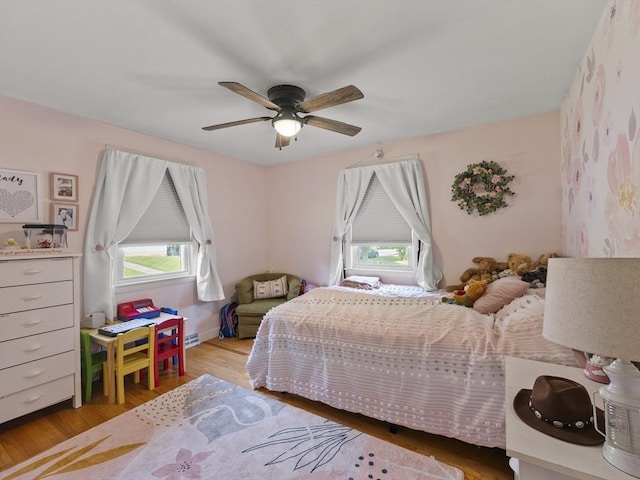 20 Dunshire Dr, Chelmsford, MA 01863 - bedroom with multiple windows, wood finished floors, and ceiling fan