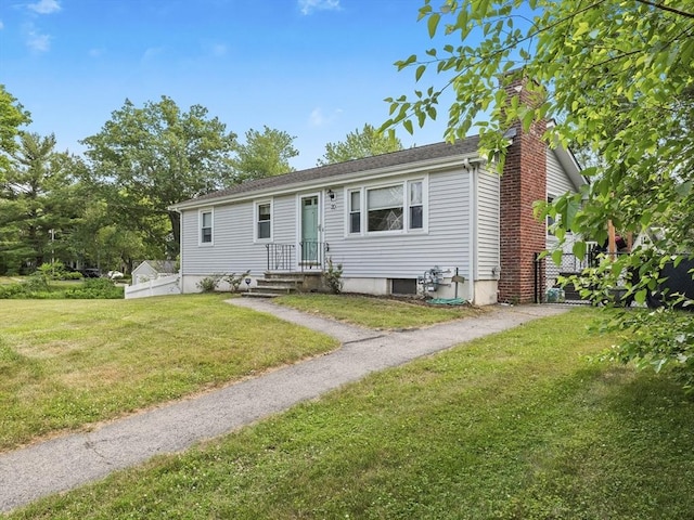 20 Dunshire Dr, Chelmsford, MA 01863 - view of front of home featuring a chimney and a front yard