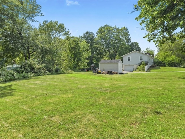 20 Dunshire Dr, Chelmsford, MA 01863 - view of grassy yard with a shed and a detached garage