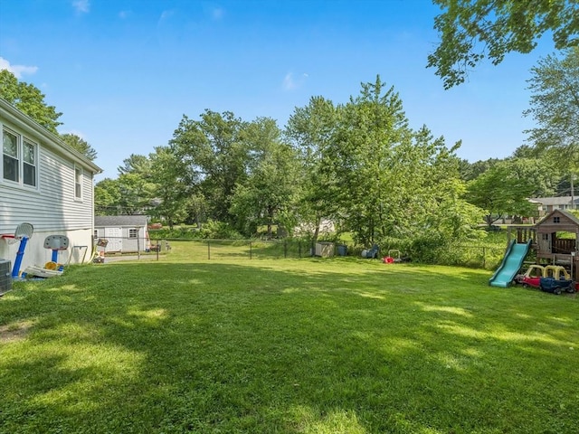 20 Dunshire Dr, Chelmsford, MA 01863 - view of yard with a playground and view of wooded area