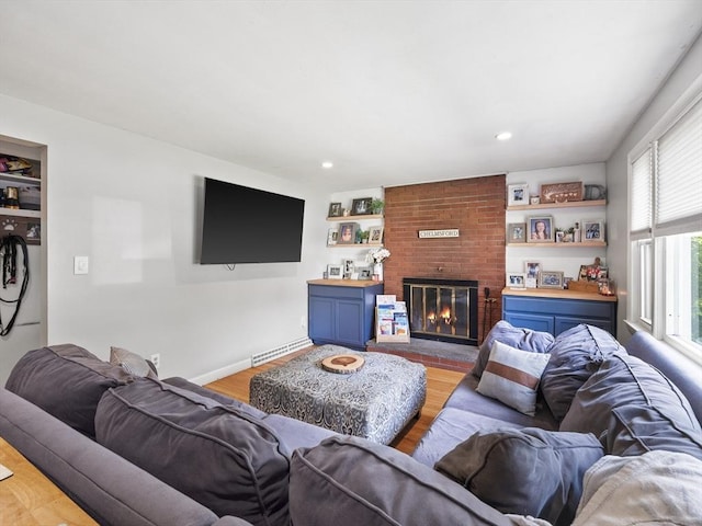 20 Dunshire Dr, Chelmsford, MA 01863 - living area featuring a fireplace, light wood-style floors, a baseboard heating unit, and recessed lighting