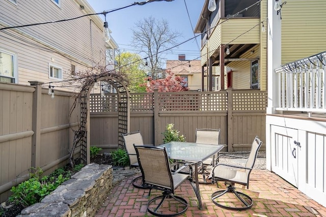 view of patio / terrace featuring outdoor dining area and a fenced backyard