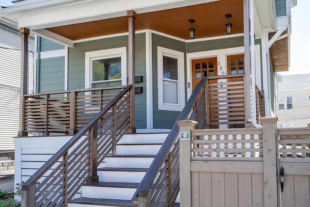 entrance to property featuring a porch