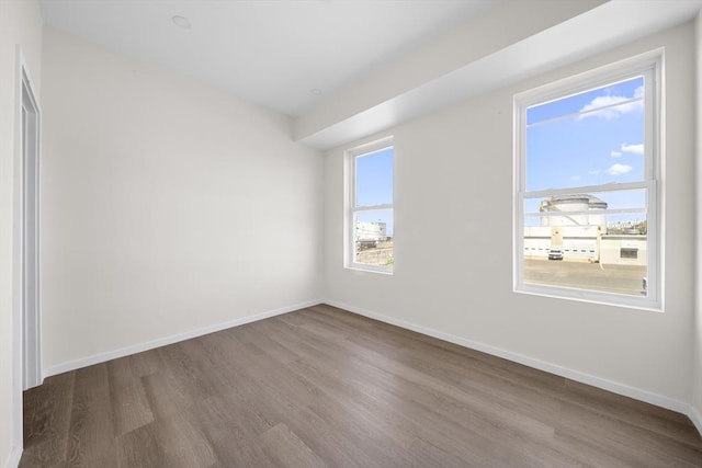 546 Saratoga Unit 1, Boston, MA 02128 - spare room with wood finished floors and baseboards