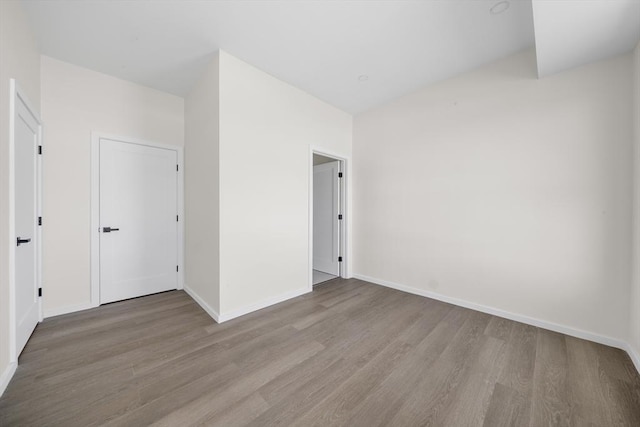 546 Saratoga Unit 1, Boston, MA 02128 - empty room featuring wood finished floors and baseboards