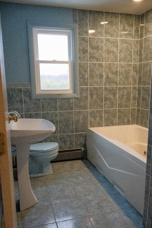 full bathroom featuring a baseboard heating unit, shower / bath combination, toilet, and tile walls