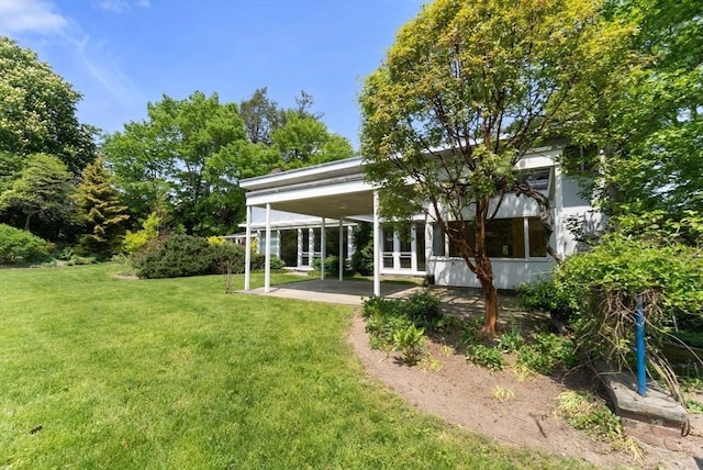 view of yard with a patio and french doors