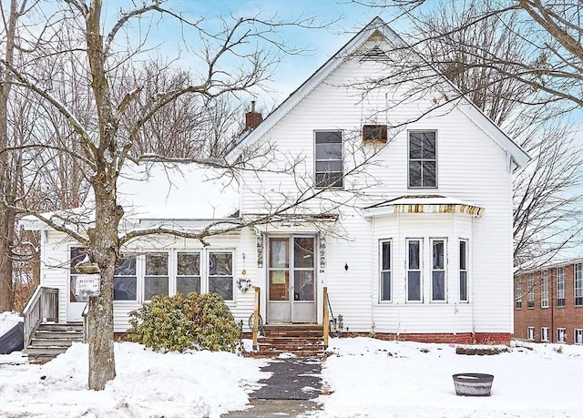 view of front of property with an outdoor fire pit