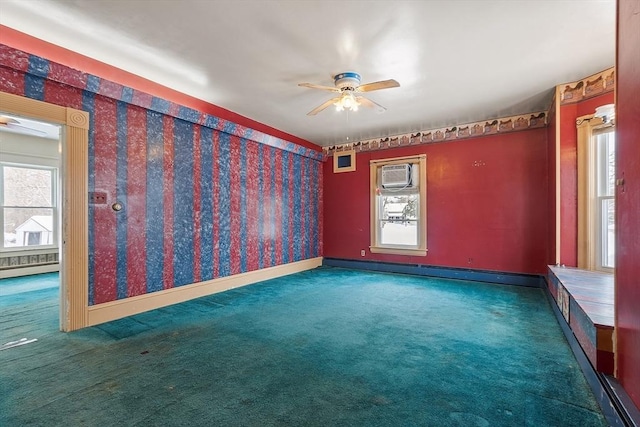 carpeted empty room featuring ceiling fan and plenty of natural light