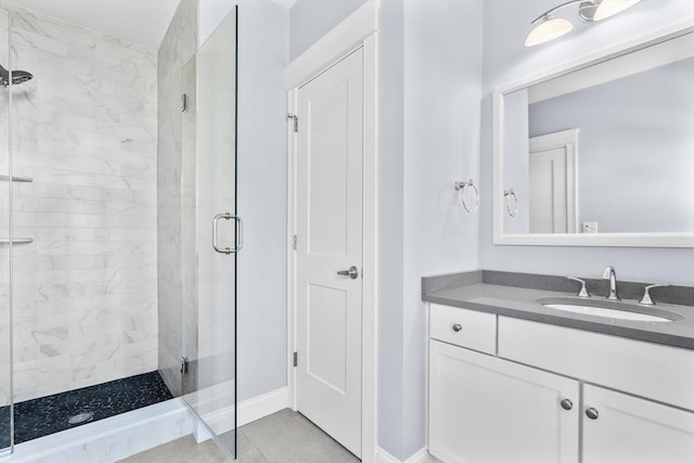 22 Chickatawbut St Unit 2, Boston, MA 02122 - bathroom featuring vanity, baseboards, a stall shower, and tile patterned floors
