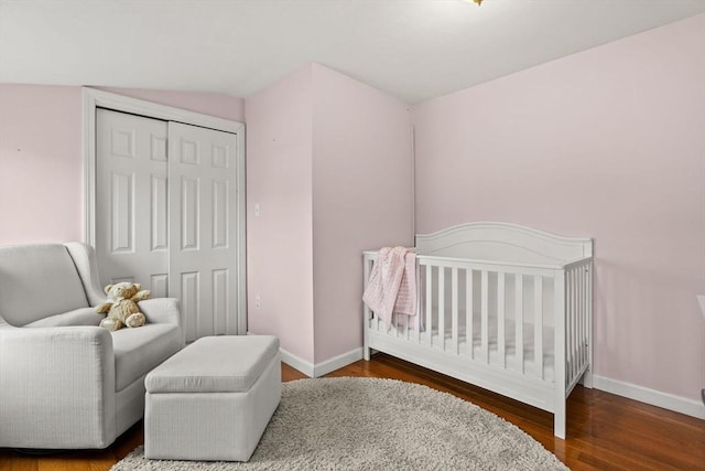 55 Rosemont Rd, Weymouth, MA 02191 - bedroom with wood finished floors, a closet, and a nursery area