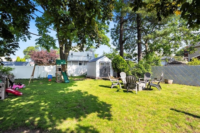 55 Rosemont Rd, Weymouth, MA 02191 - fenced backyard featuring a playground and a storage shed