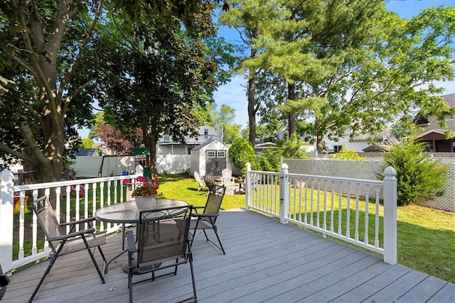 55 Rosemont Rd, Weymouth, MA 02191 - deck featuring a storage unit, outdoor dining space, and a fenced backyard
