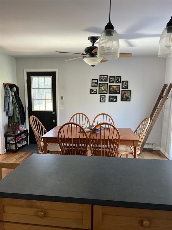 106 Shaw Rd, Goshen, MA 01330 - dining room featuring a ceiling fan, wood finished floors, and baseboards