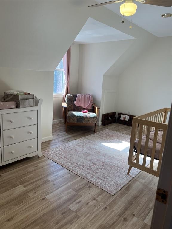 106 Shaw Rd, Goshen, MA 01330 - bedroom featuring wood finished floors, a ceiling fan, baseboards, and vaulted ceiling