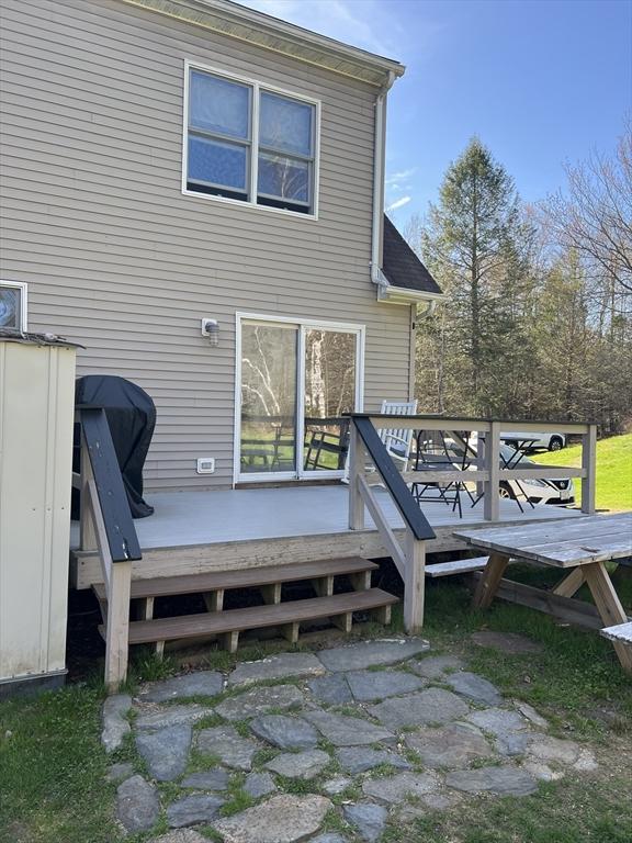 106 Shaw Rd, Goshen, MA 01330 - back of property with a deck