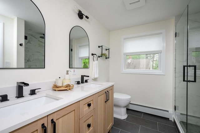bathroom with a baseboard radiator, a marble finish shower, toilet, double vanity, and tile patterned floors