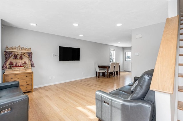 living room with baseboards, stairway, wood finished floors, and recessed lighting