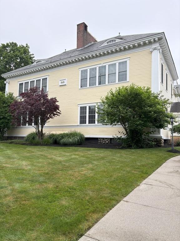 48 Phillips Rd Unit 17, Holden, MA 01520 - view of property exterior featuring a chimney and a yard
