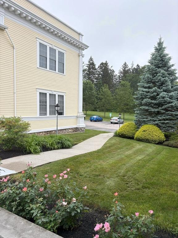 48 Phillips Rd Unit 17, Holden, MA 01520 - view of home's exterior featuring a lawn