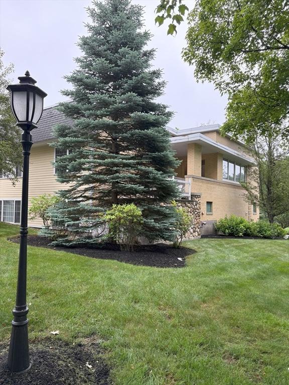 48 Phillips Rd Unit 17, Holden, MA 01520 - view of side of property featuring a yard