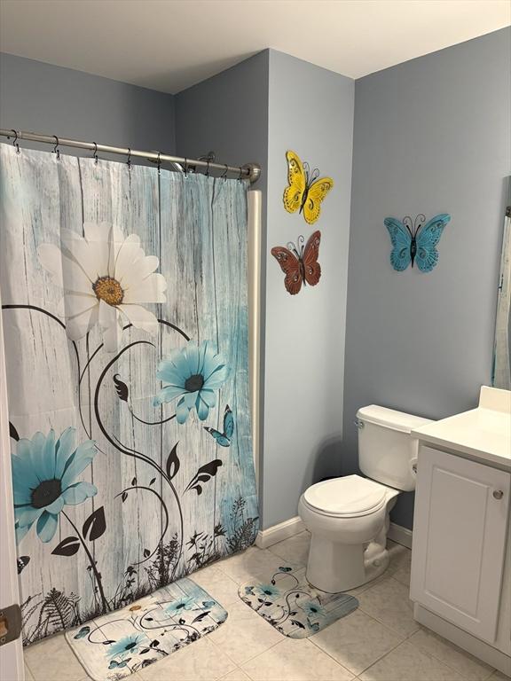 48 Phillips Rd Unit 17, Holden, MA 01520 - full bath with vanity, a shower with curtain, and tile patterned flooring