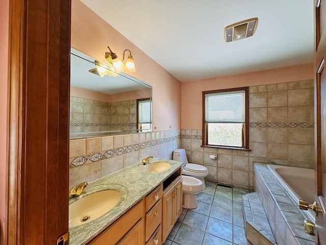 full bathroom with tile walls, tile patterned flooring, a bidet, and a sink